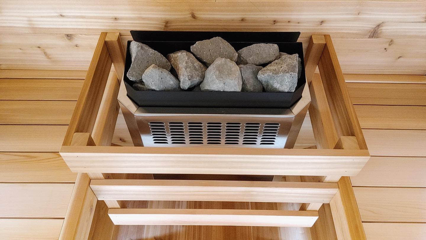 Homecraft H-Series electric sauna heater top view installed in cedar safety cage