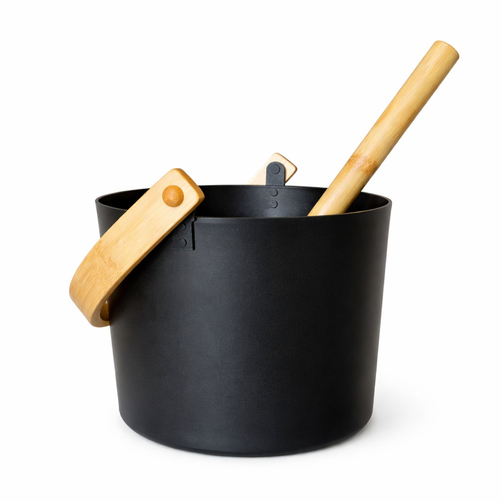 Modern black metal sauna bucket and matching ladle product set isolated on a clean white background
