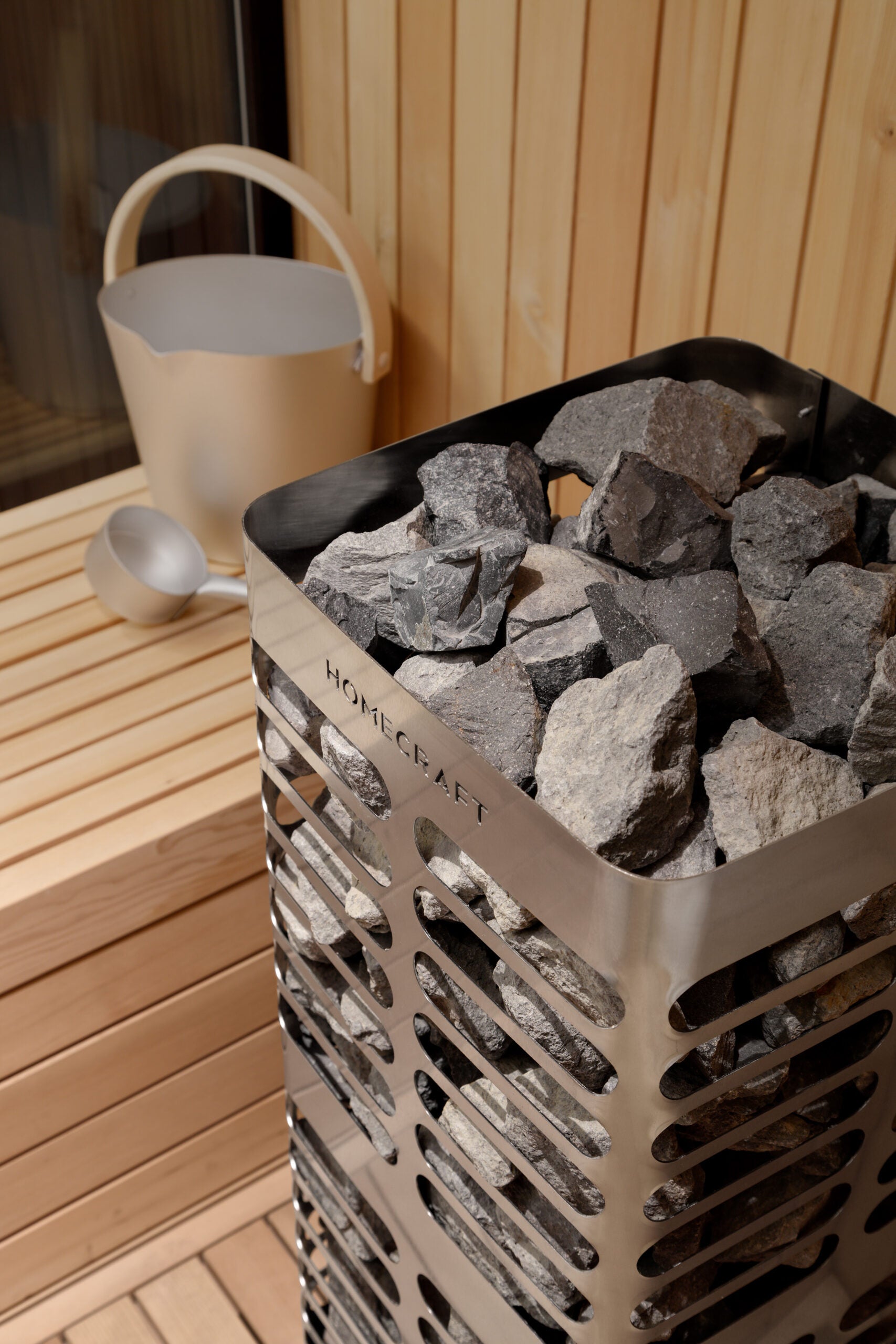 Homecraft revive stainless steel electric sauna heater in a cedar sauna room